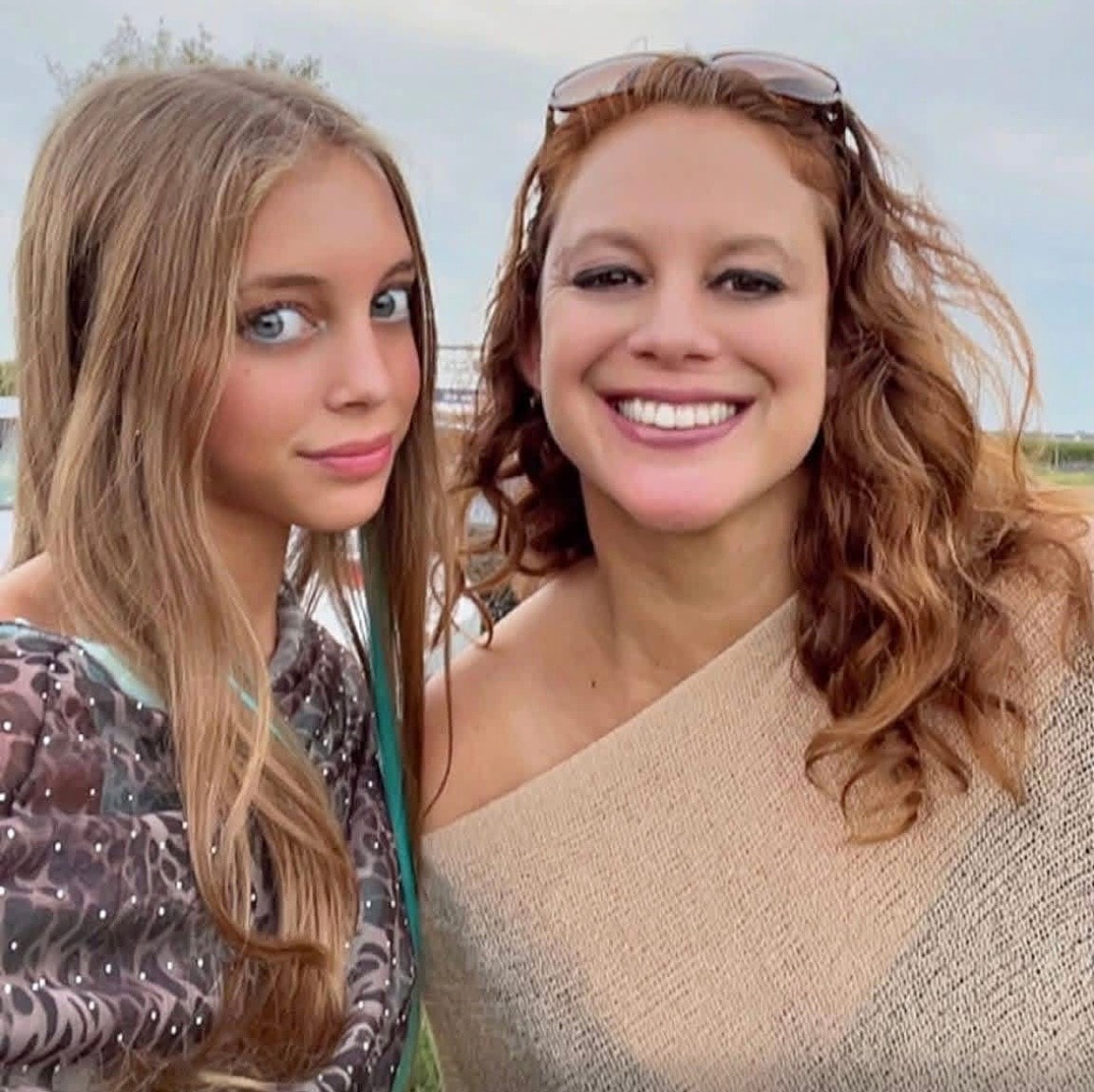 Two women smiling outdoors together